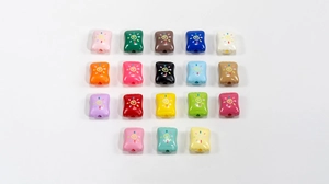 Macro view of assorted colorful acrylic candy beads with sun-style spiral G pattern