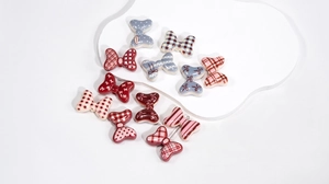 Macro detail of colorful butterfly resin beads with patterns for DIY craft jewelry