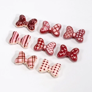 Set of 7 vintage resin bow beads with pink stripes and polka dots for DIY jewelry making
