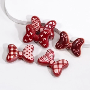 Vintage resin bow charms in red plaid and polka dots for DIY jewelry and hair accessories