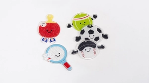 Detailed view of five acrylic sports ball charms with glitter and cute cartoon faces