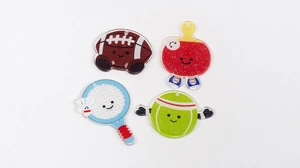 Detail of glitter acrylic sports keychains featuring cartoon ball designs with smiling faces