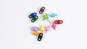 Detailed view of colorful enamel barrel screw clasps for DIY jewelry making and bracelets