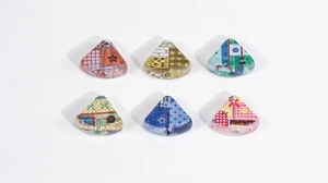 Detail view of colorful acrylic cake beads with patchwork patterns for DIY crafts