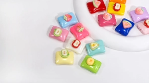 Macro view of colorful acrylic fruit candy beads for DIY jewelry and accessory making