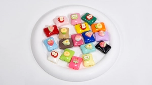 Detailed view of colorful acrylic fruit square beads for DIY jewelry and phone charms