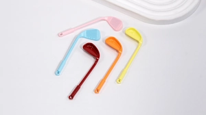 Detailed view of colorful golf club charms with ribbed textures and hanging holes