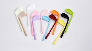 Detail of golf club shaped alloy charms in eleven vibrant colors for DIY jewelry making