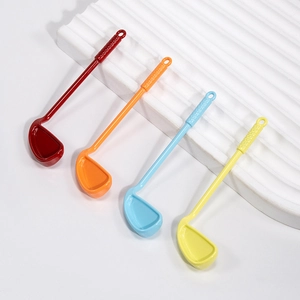 Set of four colorful golf club shaped spoons for coffee stirring and creative dessert serving