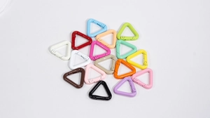 Close-up of assorted colorful triangular spring snap hooks for DIY keychains and bags