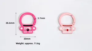 Detailed macro view of astronaut shaped carabiner clips in pink painted alloy
