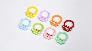Close-up of eight colorful matte alloy carabiner hooks in a vibrant multi-color set