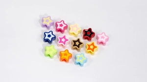 Close-up of colorful acrylic star-shaped beads for DIY jewelry and necklaces