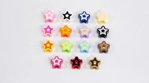 Macro view of colorful acrylic star-shaped beads for DIY handmade jewelry and crafts