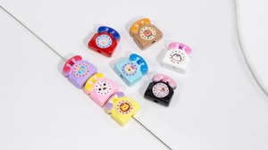 Macro shot of colorful acrylic retro telephone beads with animal patterns for DIY jewelry