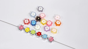 Close-up of mixed acrylic flower beads for DIY jewelry and phone chain accessories