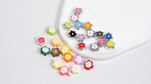 Macro shot of colorful acrylic flower beads for DIY jewelry and phone chain accessories