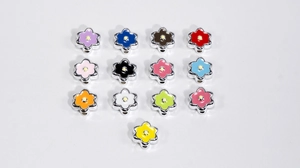 Detailed shot of 13 colorful acrylic six-petal flower beads for DIY jewelry making