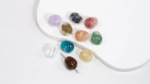 Macro shot of assorted colorful marble texture resin beads with large holes for DIY crafts