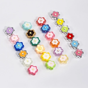 Colorful acrylic six-petal flower beads in various shades for DIY jewelry and keychains
