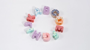 DIY alphabet beads with colorful plaid patterns and pre-drilled holes for jewelry making