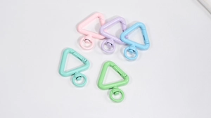 Macro shot of triangle lobster clasps in colorful pastel macaron finish alloy