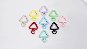 Detailed top view of triangular alloy spring buckles in ten assorted painted colors