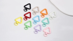 Detailed set of colorful triangular spring gate hooks with 360-degree swivel rings