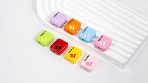 Macro view of colorful square acrylic joker beads with holes for DIY jewelry making