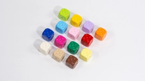 Detailed top view of 14 colorful acrylic dice beads for DIY jewelry and phone chain making