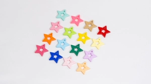 Macro detail of 16x21mm colorful hollow star-shaped resin pendants for DIY jewelry making