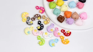 Colorful acrylic moon and heart pendants for DIY jewelry making and handmade crafts