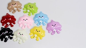 Detail of colorful smiley cloud charms with lightning icons for DIY keychains