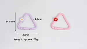 Macro detail of triangle spring clasps with flowers in purple and pink showing dimensions