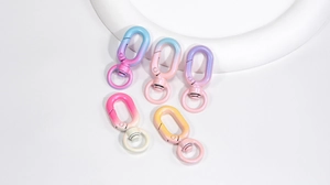 Detail of gradient painted metal lobster clasps for DIY keychains and bag accessories