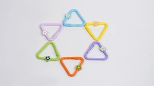 Detailed set of six colorful triangle spring rings with small flower charms for DIY crafts