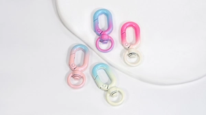 Macro shot of colorful gradient lobster clasps with 360-degree swivel rings for DIY