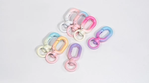 Close-up of colorful gradient lobster clasps with 360-degree rotating swivel rings