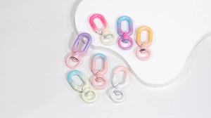 Macro shot of colorful gradient lobster clasps for DIY keychains and bag accessories