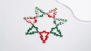 Close-up of colorful Christmas tree shaped metal spring hooks for DIY keychains