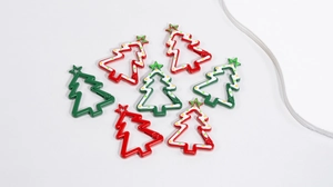 Detailed view of colorful Christmas tree metal snap hooks with festive enamel coating