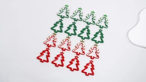 Detailed set of red and green Christmas tree shaped carabiner hooks with star clips