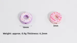 Macro detail of acrylic donut beads in pink and purple with 16mm diameter for DIY jewelry