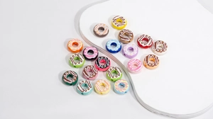 Colorful acrylic donut beads with faux frosting and sprinkles for DIY jewelry making