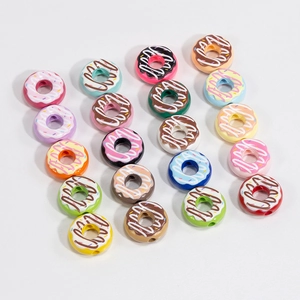 Colorful acrylic donut spacer beads with frosting and sprinkles for DIY jewelry crafts