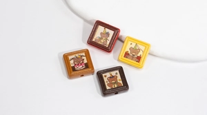 Close-up of square cartoon bear beads for DIY jewelry making in multiple colors