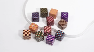 Detailed view of colorful acrylic heart checkered cube beads for DIY jewelry making
