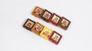Detail of square cartoon bear beads for DIY jewelry with decorative festive illustrations