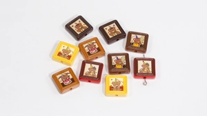 Close-up of square bear beads with Happy Bear prints for DIY handmade jewelry crafts