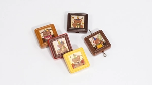 Detailed set of five cartoon bear resin beads with vibrant celebration patterns for DIY crafts
